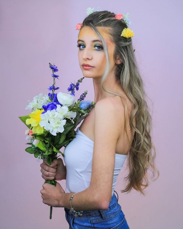 Actor headshot, spring florals, lavender backdrop